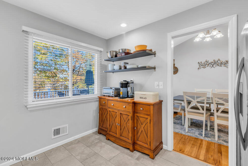 56 Bethany Road Holmdel, NJ 07733 - Photo 5 of 19 a kitchen with stainless steel appliances granite countertop a stove a sink and a refrigerator