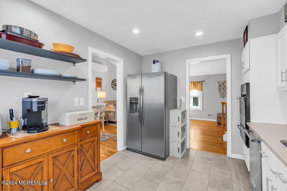 56 Bethany Road Holmdel, NJ 07733 - Photo 7 of 19 a kitchen with stainless steel appliances granite countertop a refrigerator and a sink