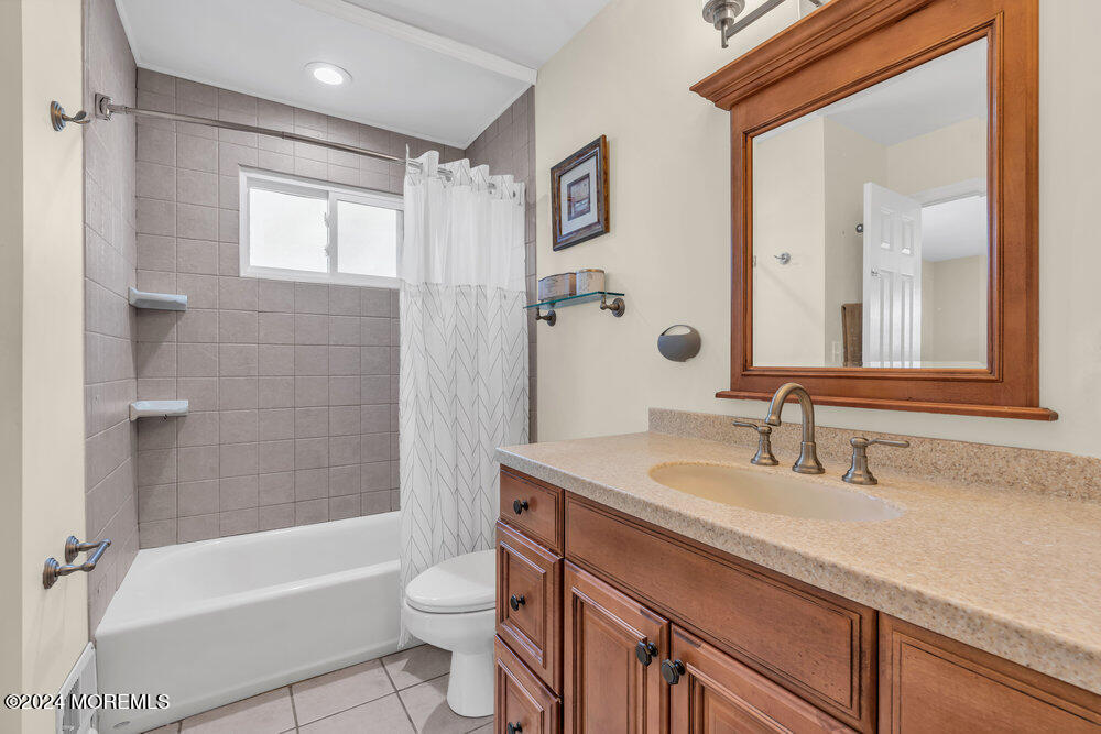 56 Bethany Road Holmdel, NJ 07733 - Photo 9 of 19 a bathroom with a sink a toilet and shower