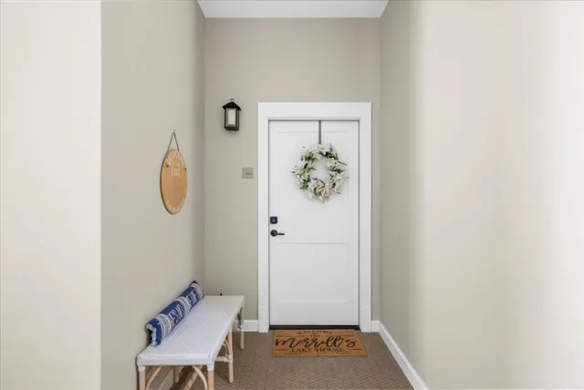 a view of an entryway with wooden floor