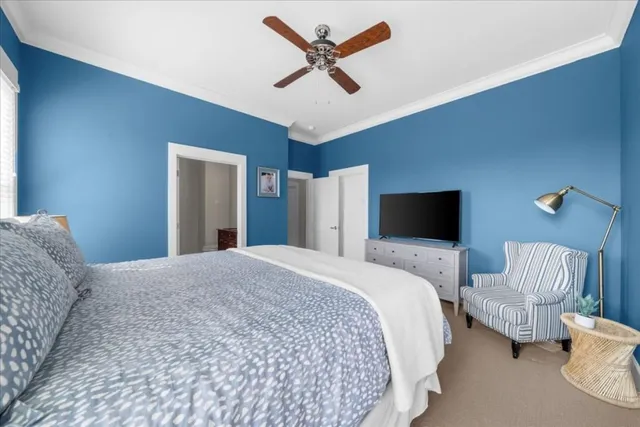 a spacious bathroom with a granite countertop sink a toilet and a mirror