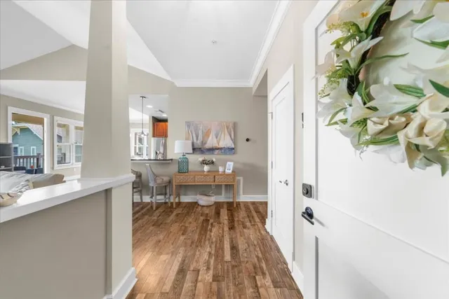 a view of a dining room with a table and chairs