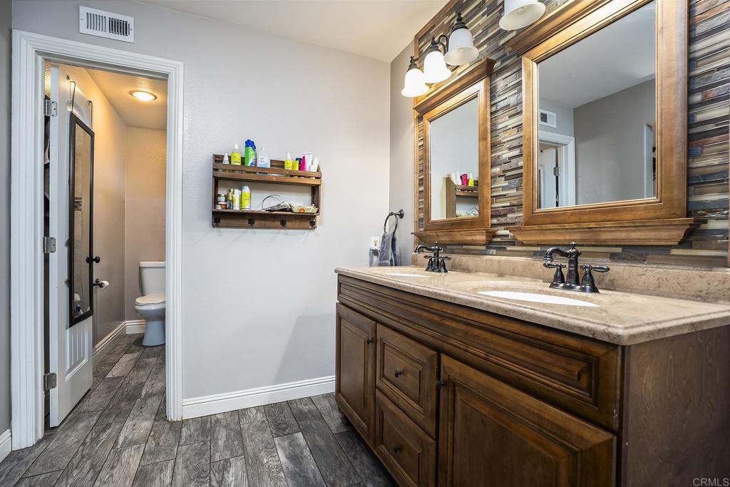 2430 Geyer Lane Alpine, CA 91901 - Photo 23 of 60 a bathroom with a sink and a mirror