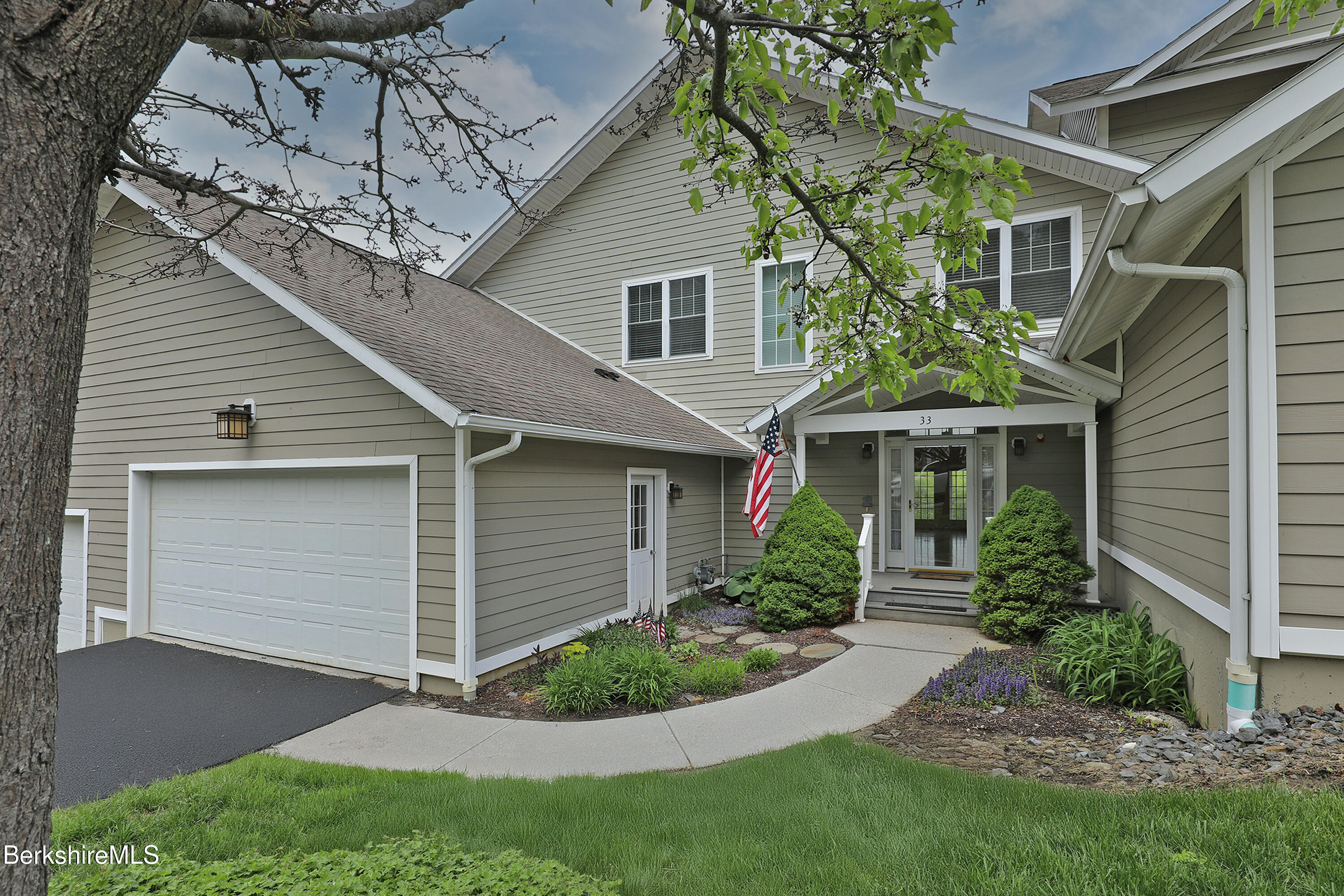 33 Alpine Trail Pittsfield, MA 01201 - Photo 2 of 69 a front view of a house with a garden