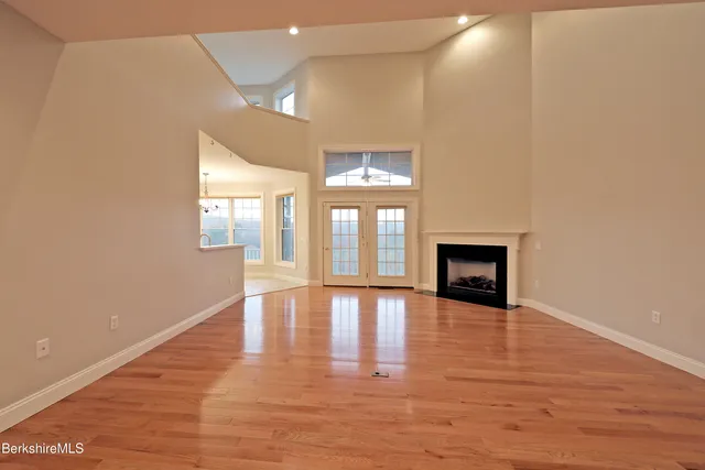 a kitchen with stainless steel appliances granite countertop a refrigerator and a stove