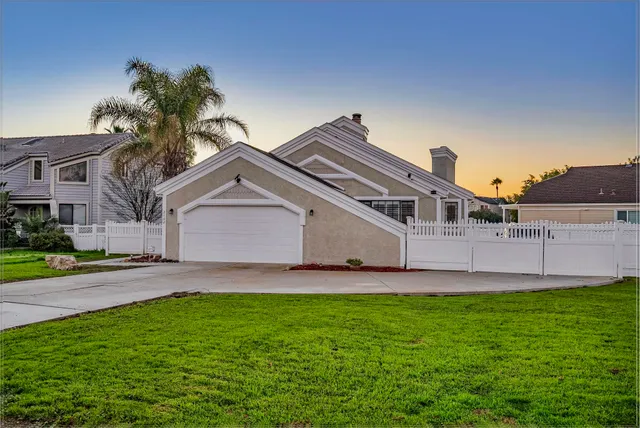 a balcony with wooden floor and city view