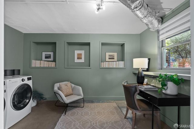 a view of a building with stairs and flowers