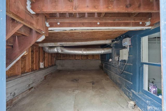 a building outdoor space with patio furniture and potted plants