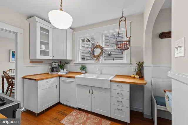 a kitchen with a sink cabinets and window