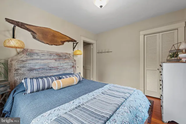 a bedroom with a bed and lamp