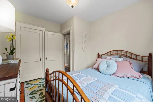 a bedroom with a bed and a dresser