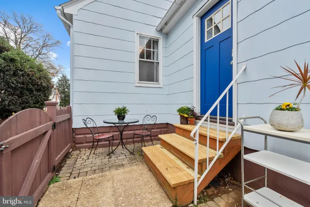a view of a patio with a table and chairs