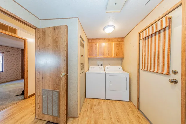 a bathroom with a sink a mirror and shower