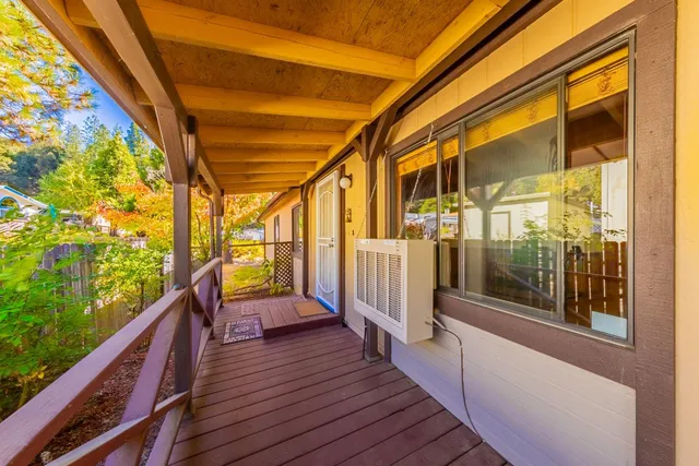 a view of a balcony with wooden floor