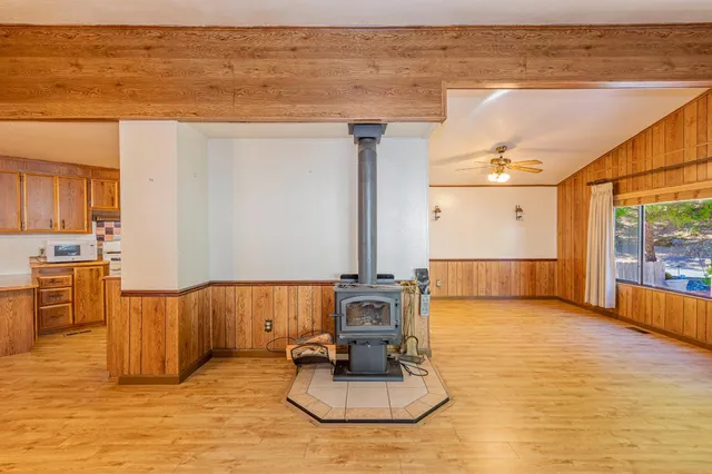 a view of kitchen with furniture and wooden floor
