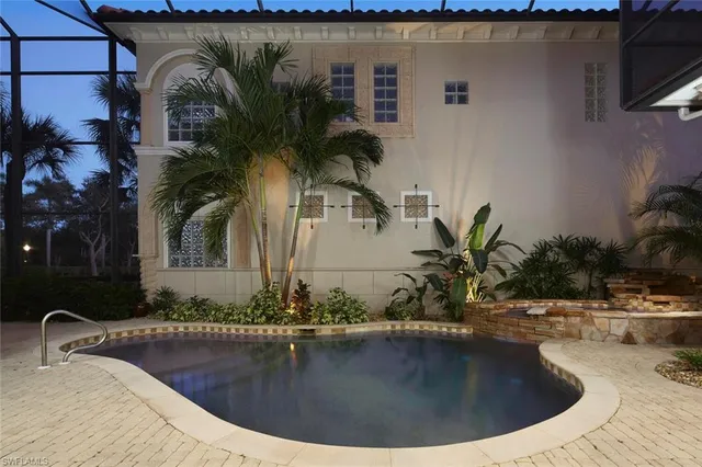 a view of a chairs and table in backyard of the house