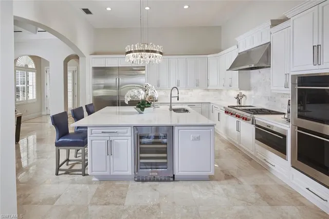 a kitchen with a stove cabinets and window