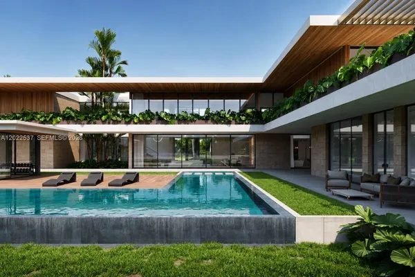 an aerial view of a house with a yard patio and dining space