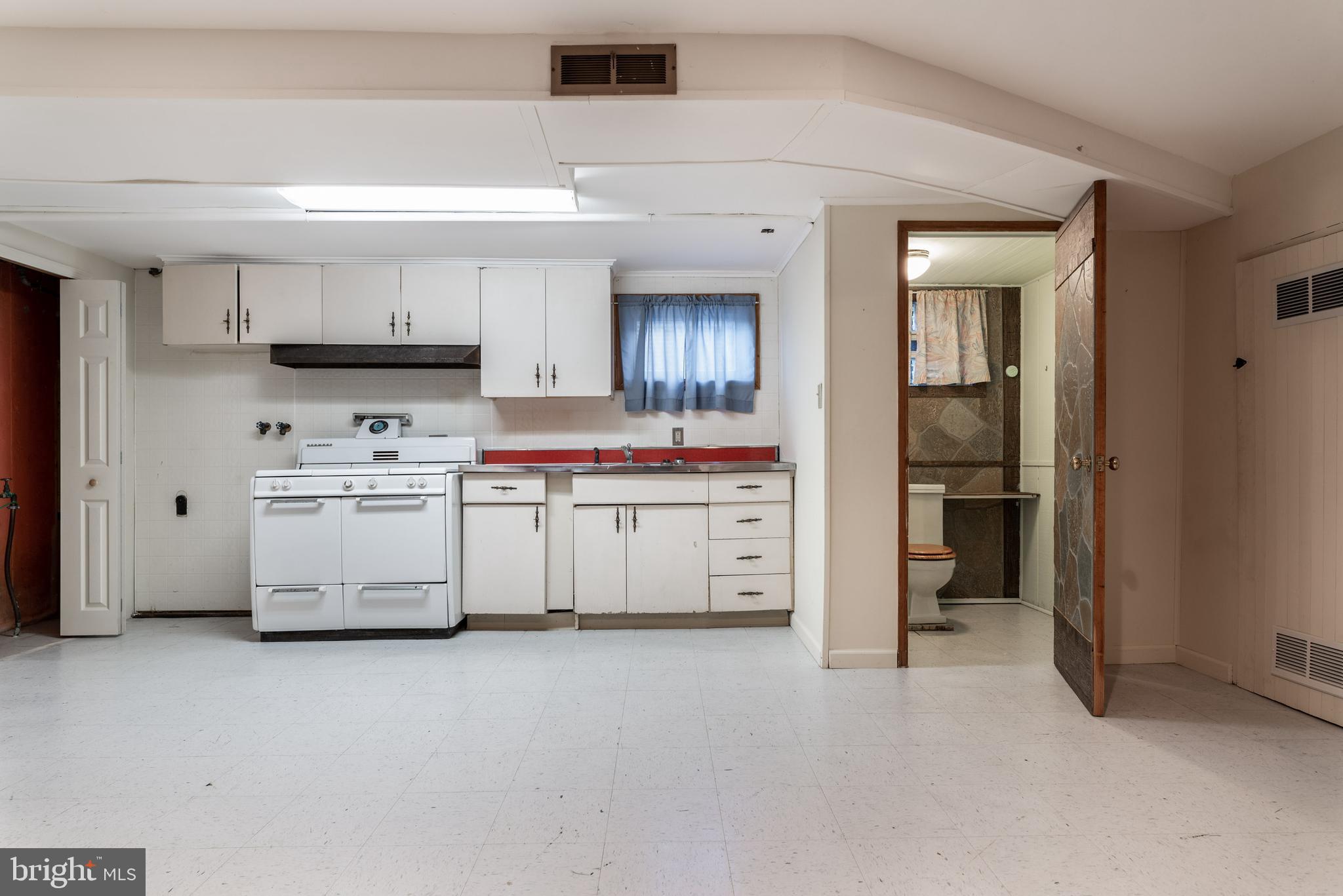 924 Springhaven Road Springfield, PA 19064 - Photo 18 of 26 Lower Level Kitchen and Powder Room.