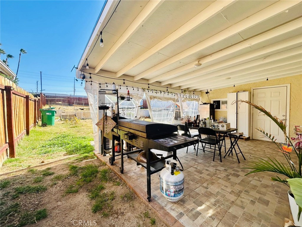250 Stephens Avenue Riverside, CA 92501 - Photo 14 of 16 a view of a patio with table and chairs