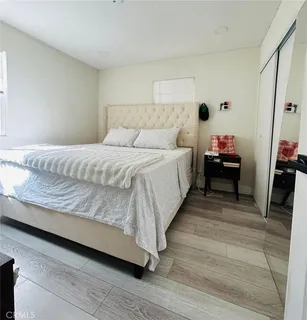 a bed room with a bed and a couch