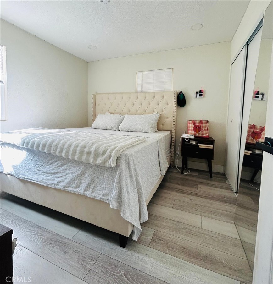 250 Stephens Avenue Riverside, CA 92501 - Photo 8 of 16 a bed room with a bed and a couch