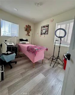 a bedroom with furniture and a chandelier