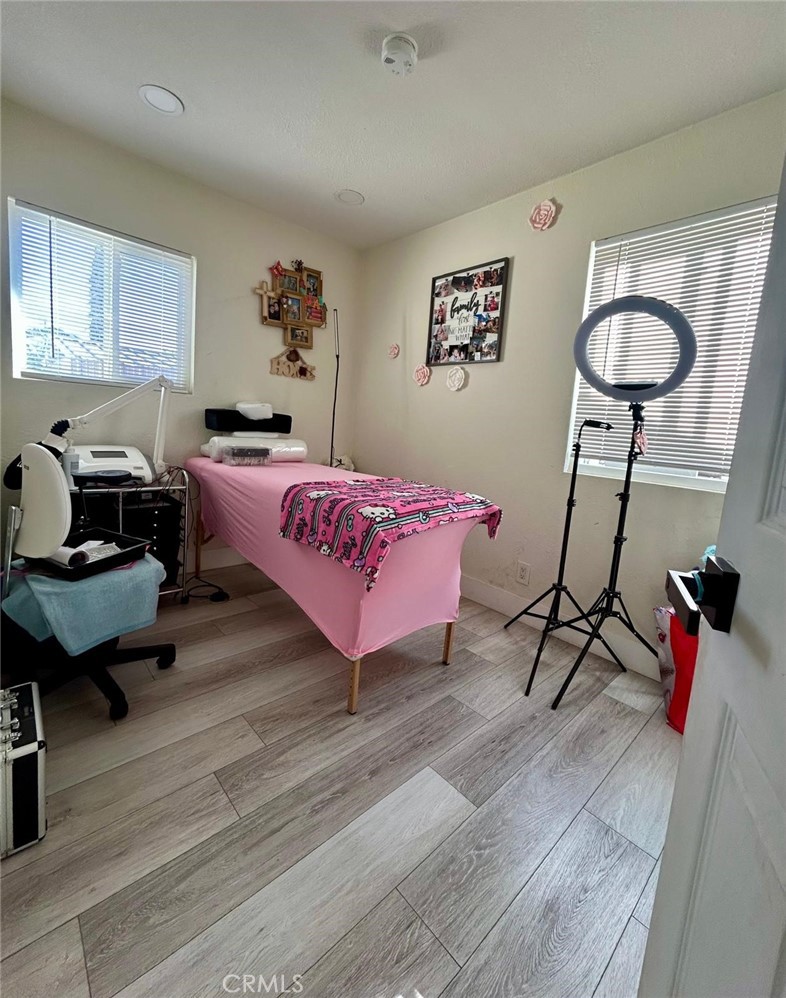 250 Stephens Avenue Riverside, CA 92501 - Photo 10 of 16 a bedroom with furniture and a chandelier