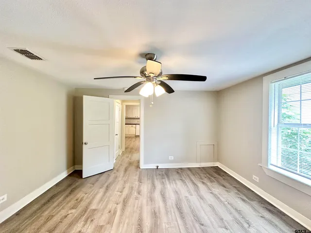 a bathroom with a bathtub and shower