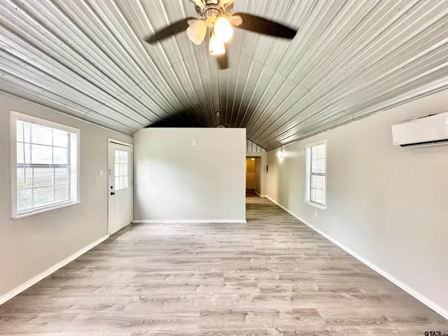 a view of outdoor space with wooden floor