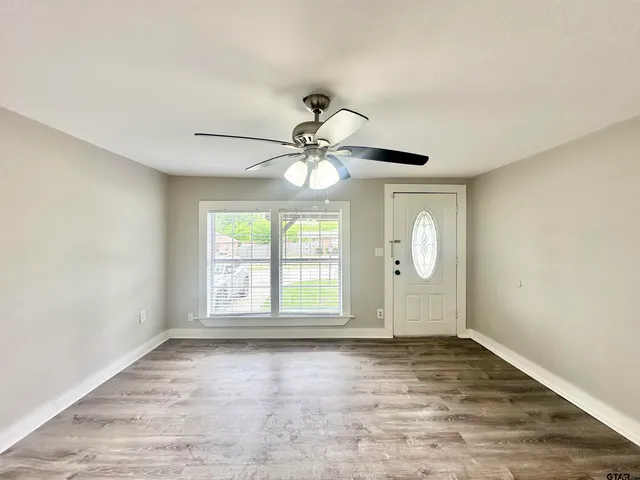 a view of an empty room with a window