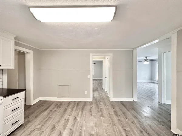a view of a kitchen with wooden floor