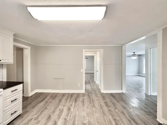a view of a kitchen with wooden floor