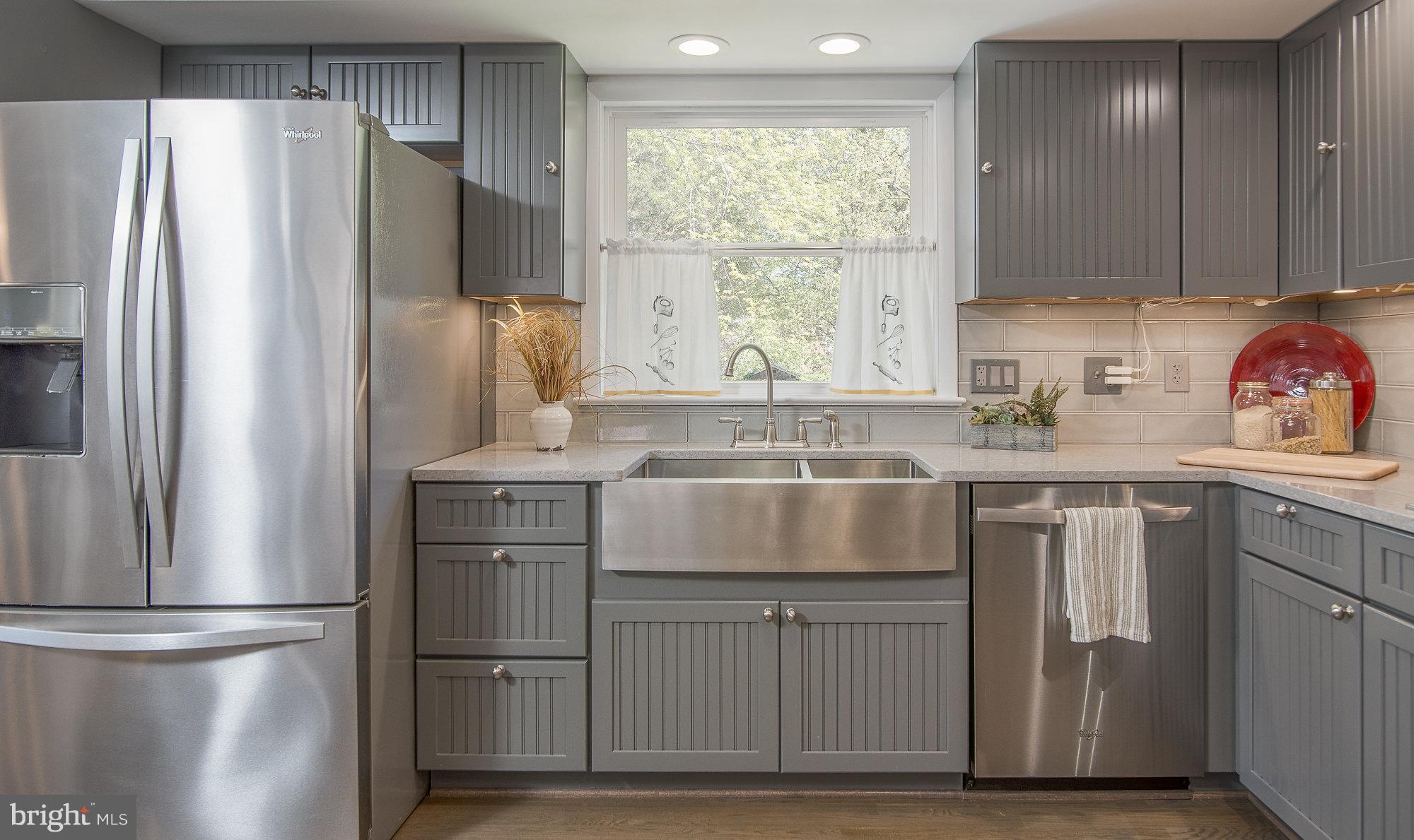 8821 Weems Road Manassas, VA 20110 - Photo 16 of 30 a kitchen with stainless steel appliances granite countertop a refrigerator and a sink