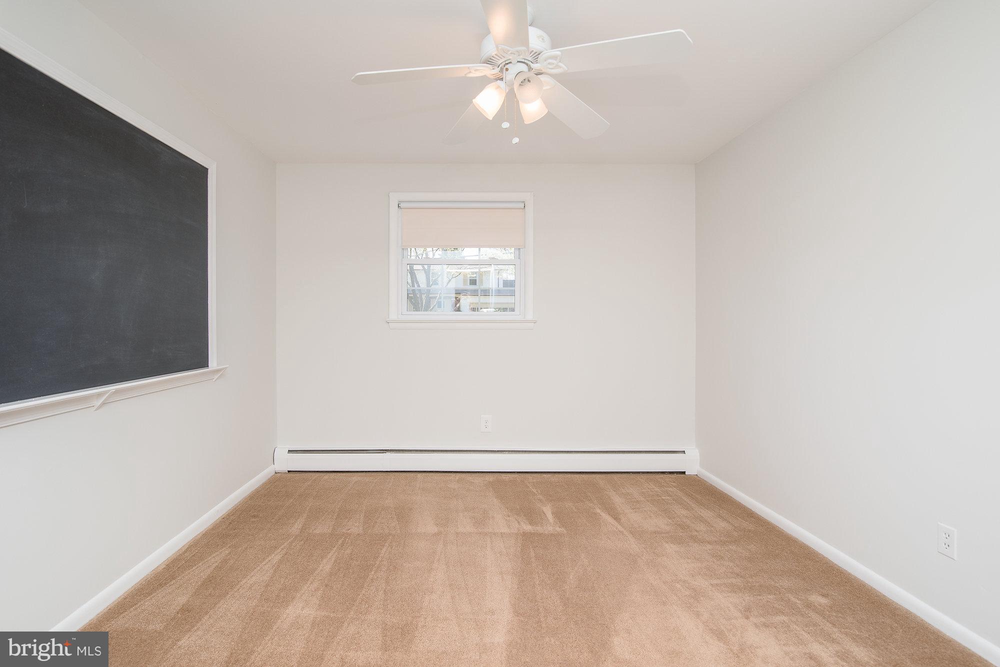 8821 Weems Road Manassas, VA 20110 - Photo 19 of 30 an empty room with a fan & a window