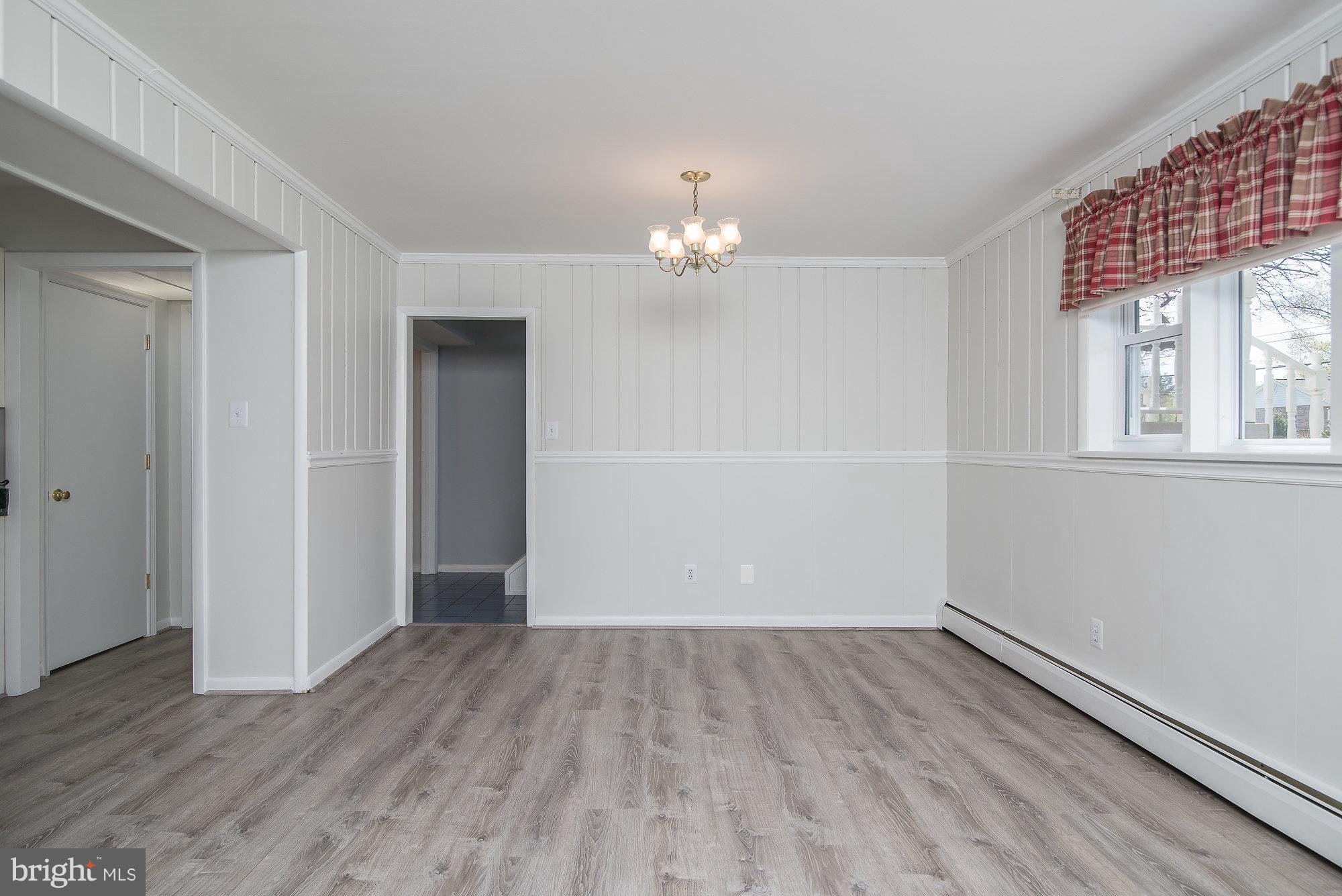 8821 Weems Road Manassas, VA 20110 - Photo 23 of 30 wooden floor in an empty room with a window