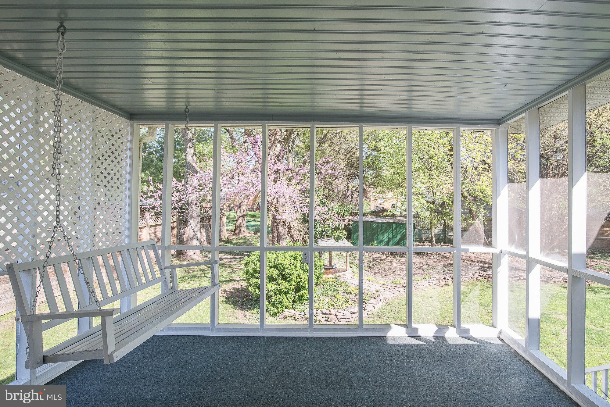 8821 Weems Road Manassas, VA 20110 - Photo 28 of 30 a view of porch with a table and chairs