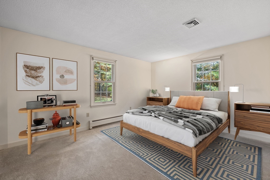 55 Warren Street Boylston, MA 01505 - Photo 14 of 30 a bedroom with a bed wooden floor and window