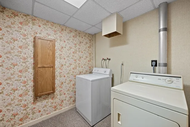 a view of storage and utility room with washer and dryer