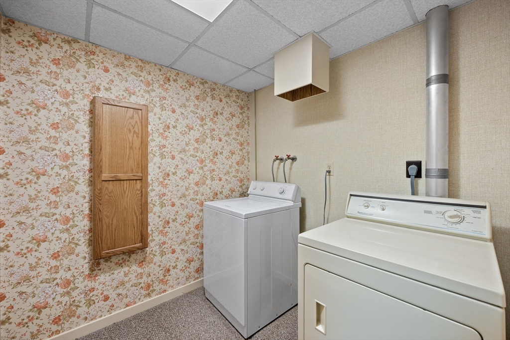55 Warren Street Boylston, MA 01505 - Photo 17 of 30 a view of storage and utility room with washer and dryer