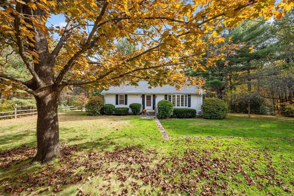 55 Warren Street Boylston, MA 01505 - Photo 2 of 30 a front view of a house with a garden