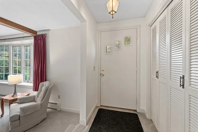 a view of room with workspace and windows