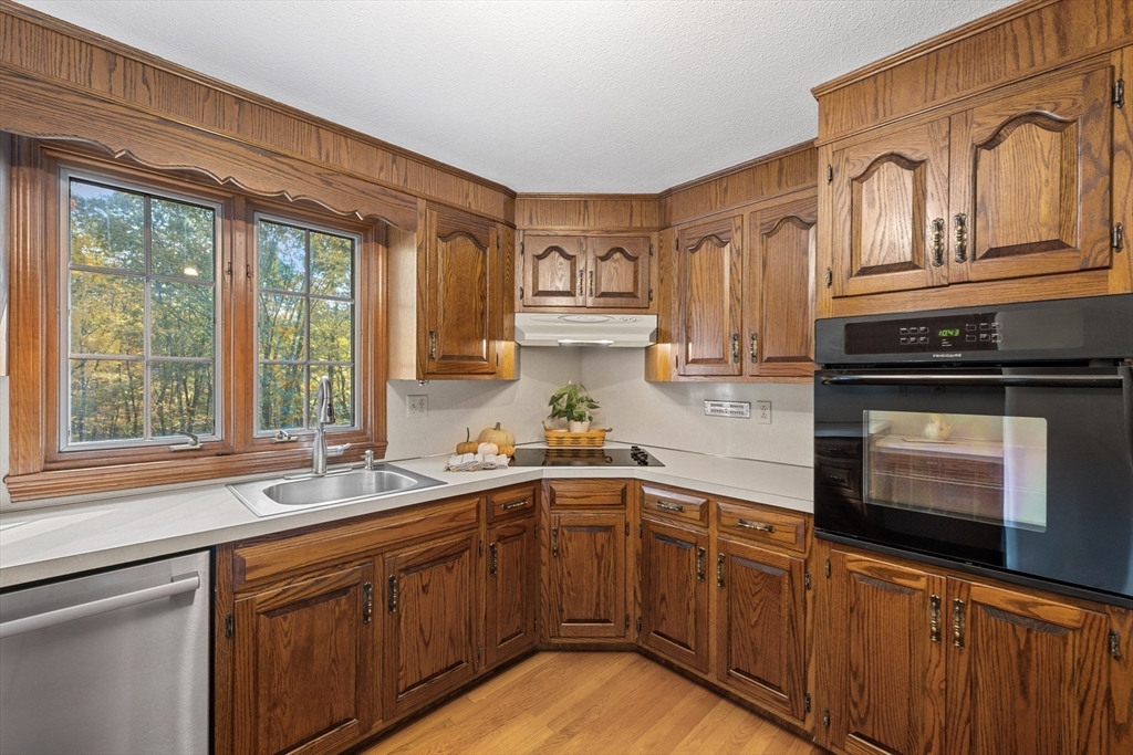 55 Warren Street Boylston, MA 01505 - Photo 10 of 30 a kitchen with stainless steel appliances granite countertop a sink stove and cabinets