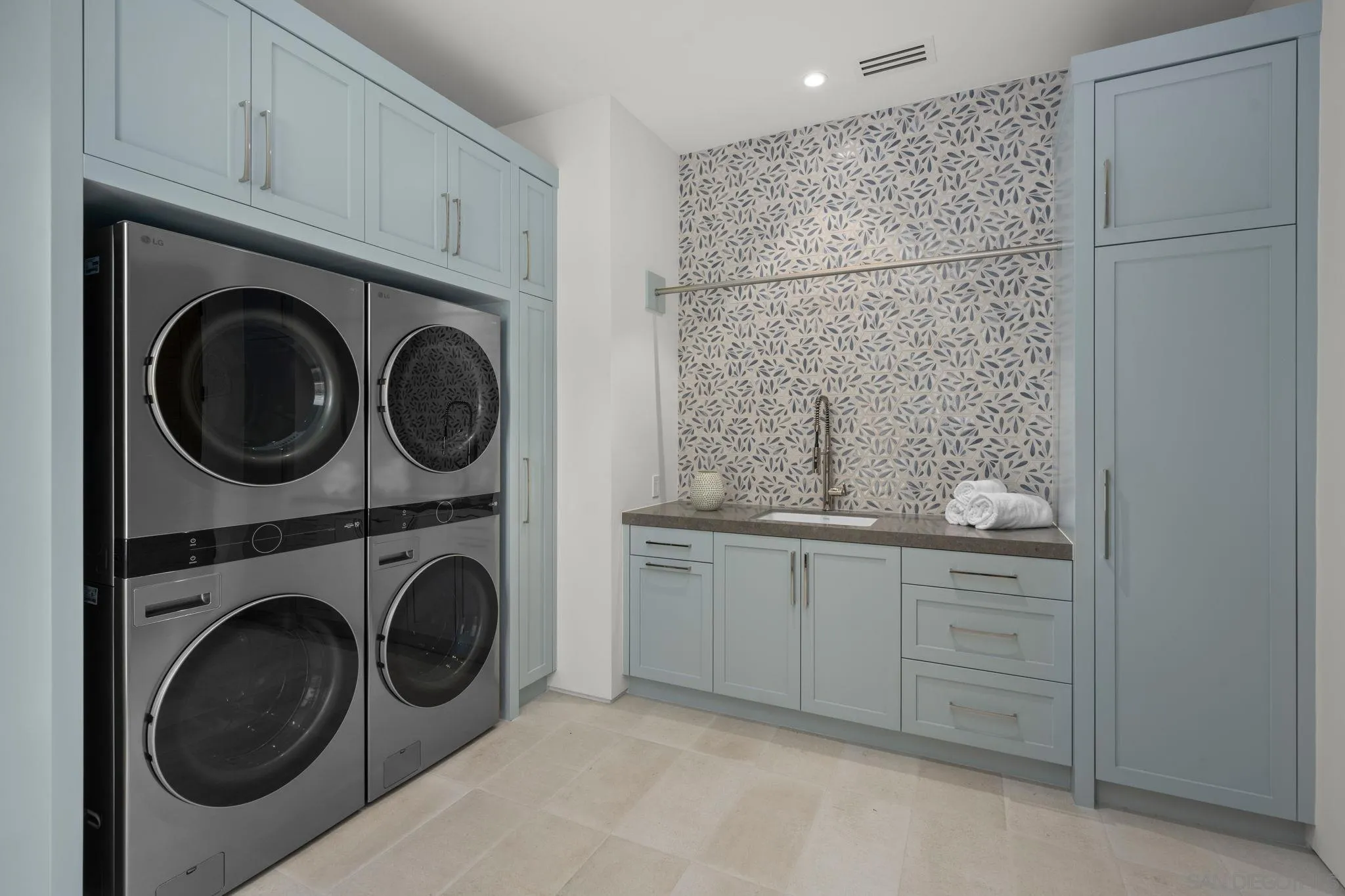 6323 Mimulus Rancho Santa Fe, CA 92067 - Photo 14 of 32 a bathroom with a sink a washer and dryer