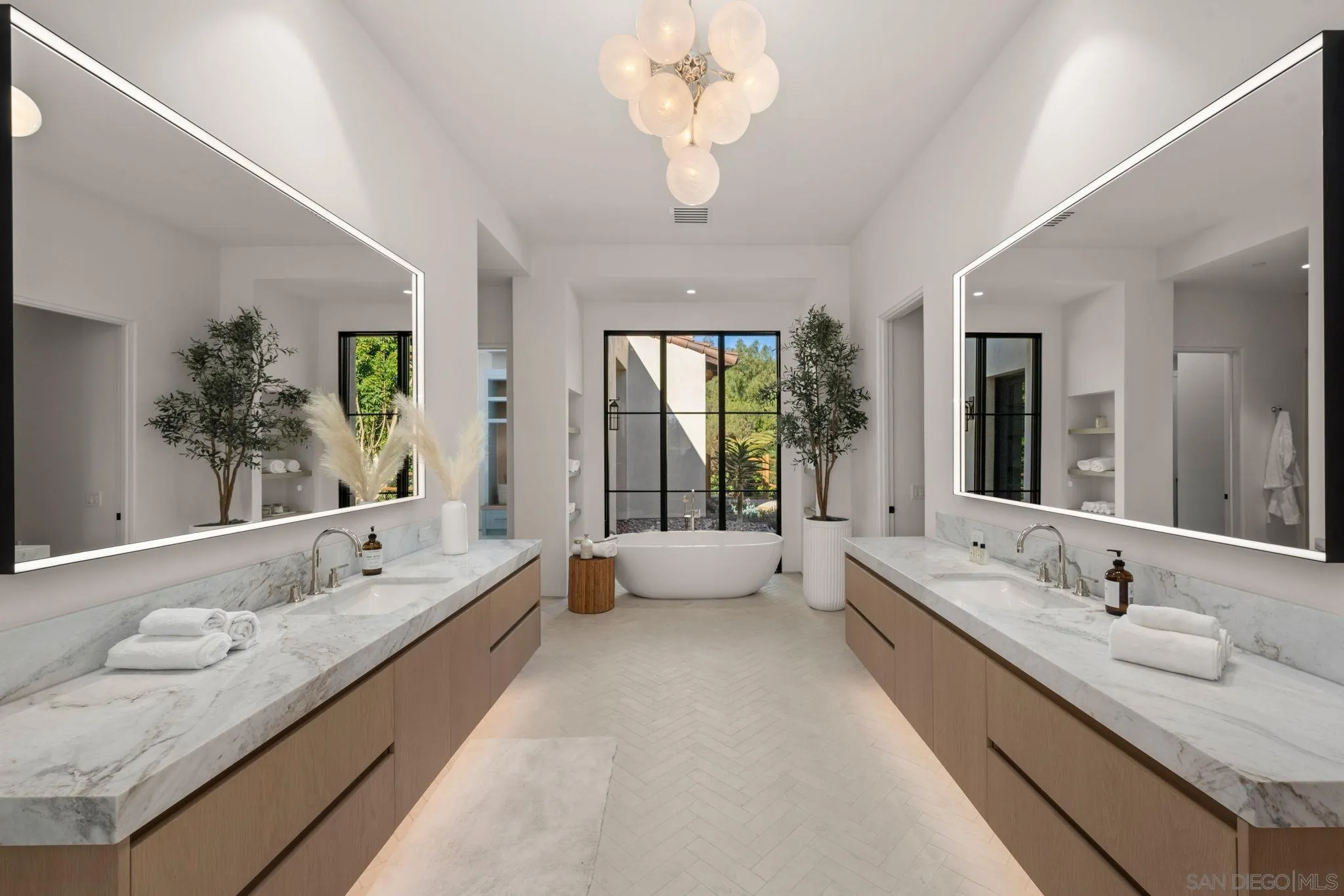 6323 Mimulus Rancho Santa Fe, CA 92067 - Photo 19 of 32 a spacious bathroom with a granite countertop sink and a large mirror