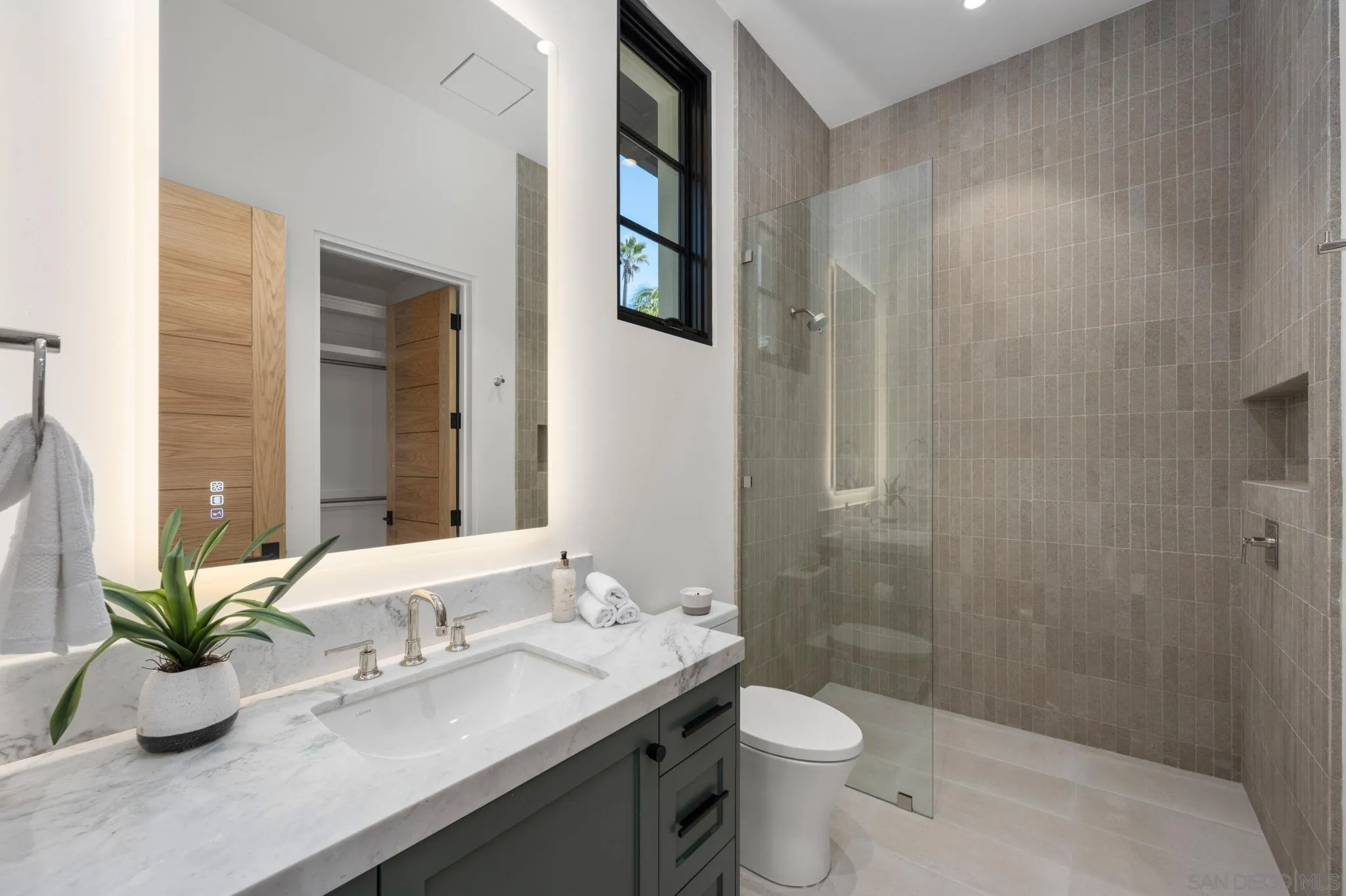 6323 Mimulus Rancho Santa Fe, CA 92067 - Photo 22 of 32 a bathroom with a granite countertop sink toilet and shower