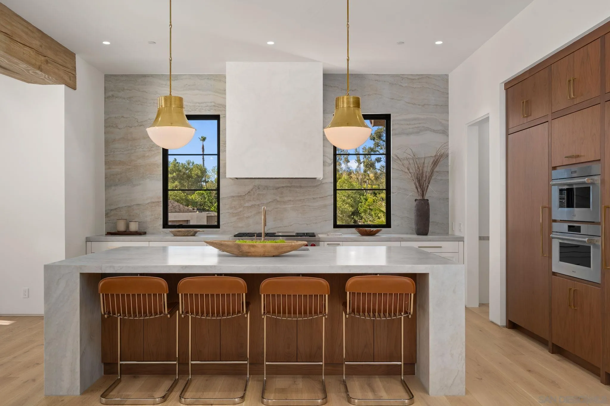 6323 Mimulus Rancho Santa Fe, CA 92067 - Photo 8 of 32 a kitchen with granite countertop a table a sink stainless steel appliances and cabinets