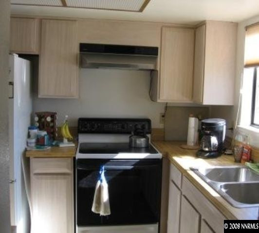 1141 Rayburn Drive Reno, NV 89503 - Photo 6 of 9 a kitchen with a sink and cabinets