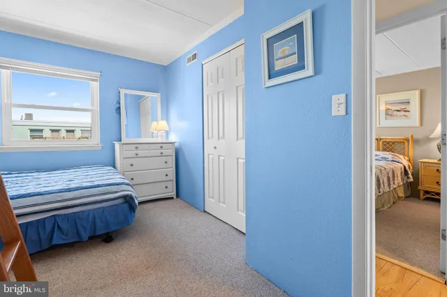 a bedroom with bed and window