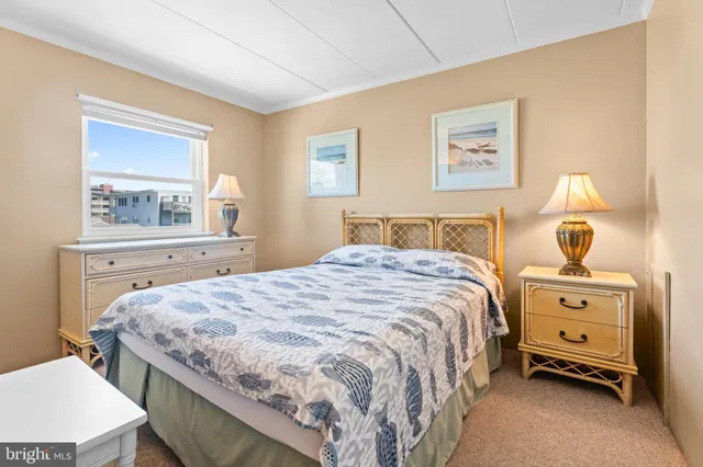 a bedroom with a bed and a table